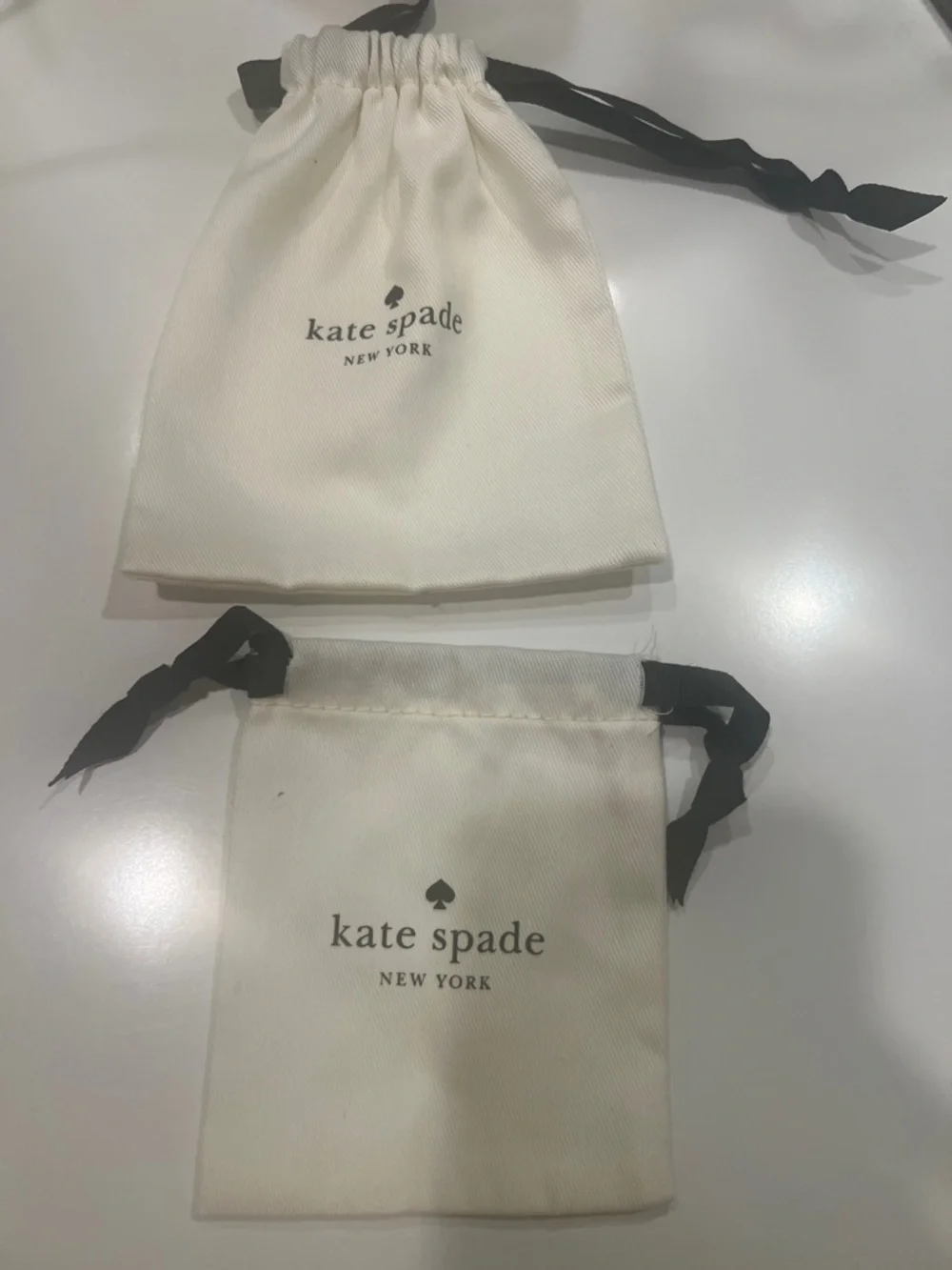 kate spade Cream Drawstring Jewelry Pouches with Black Ribbon (2)